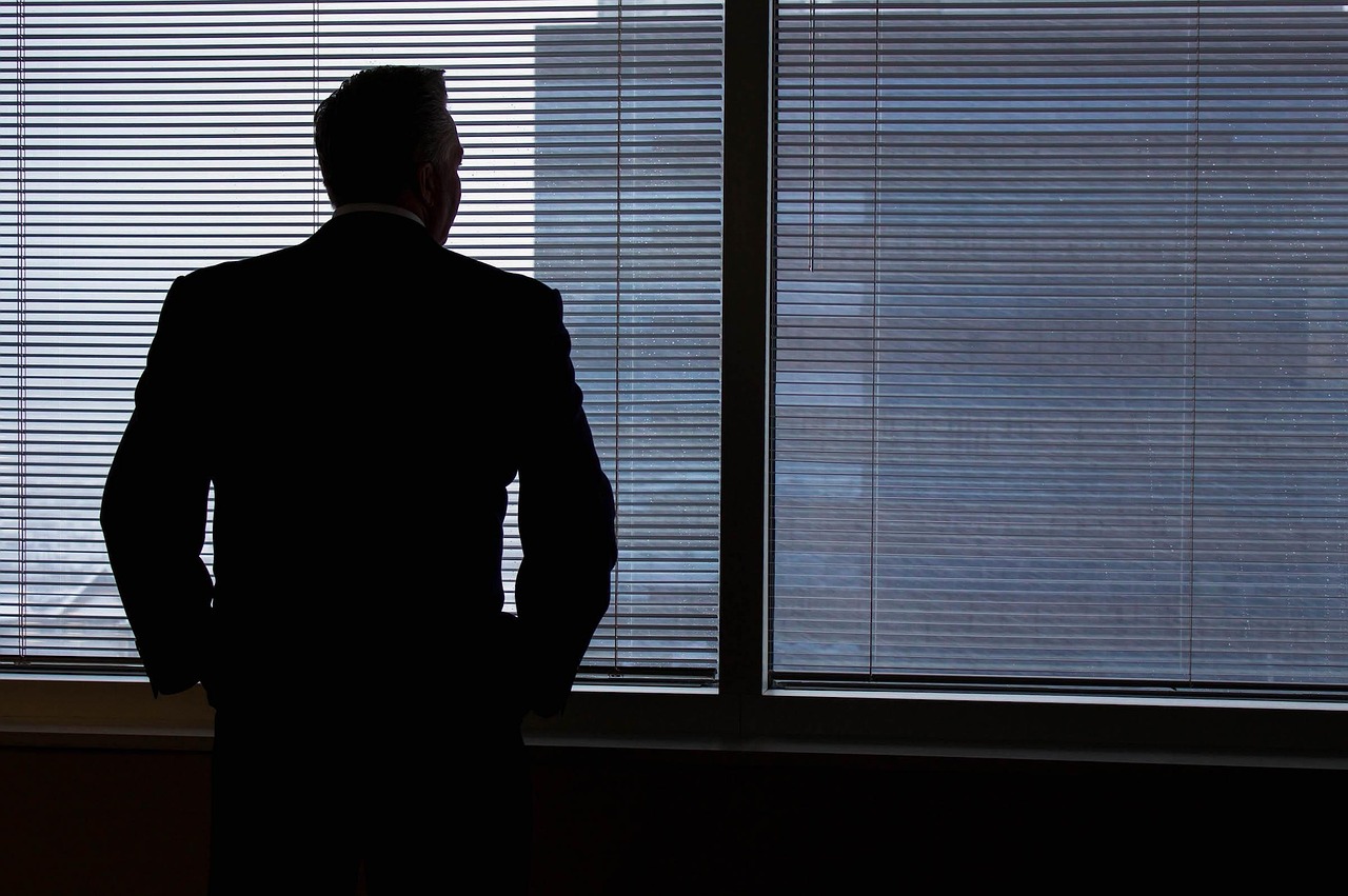 Businessman, silhouette, windows — Massage Nuru London Sessions That Heighten Intimacy and Ease Stress